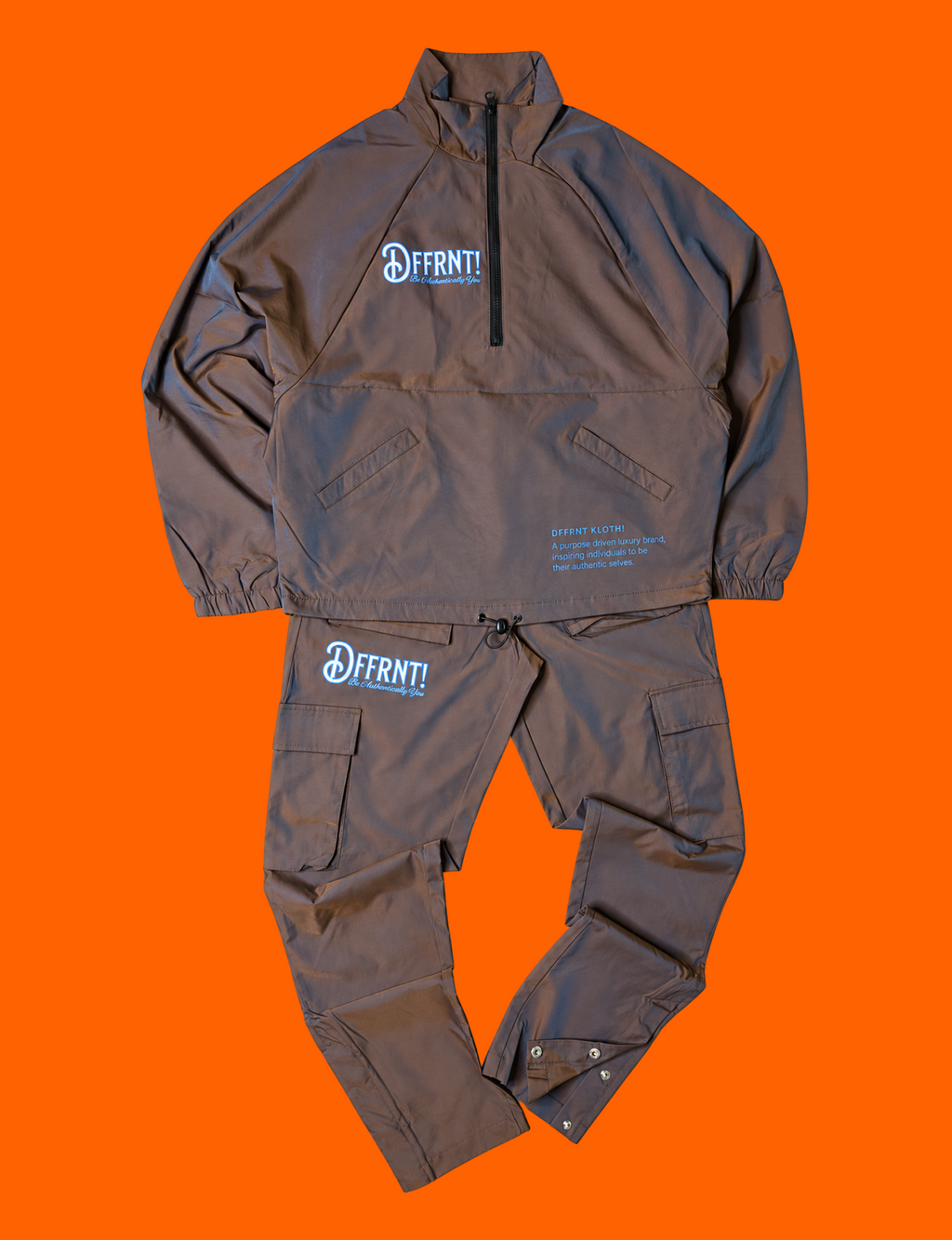 The Standard Tracksuit in brown with blue sheen and two-tone blue graphics — front view