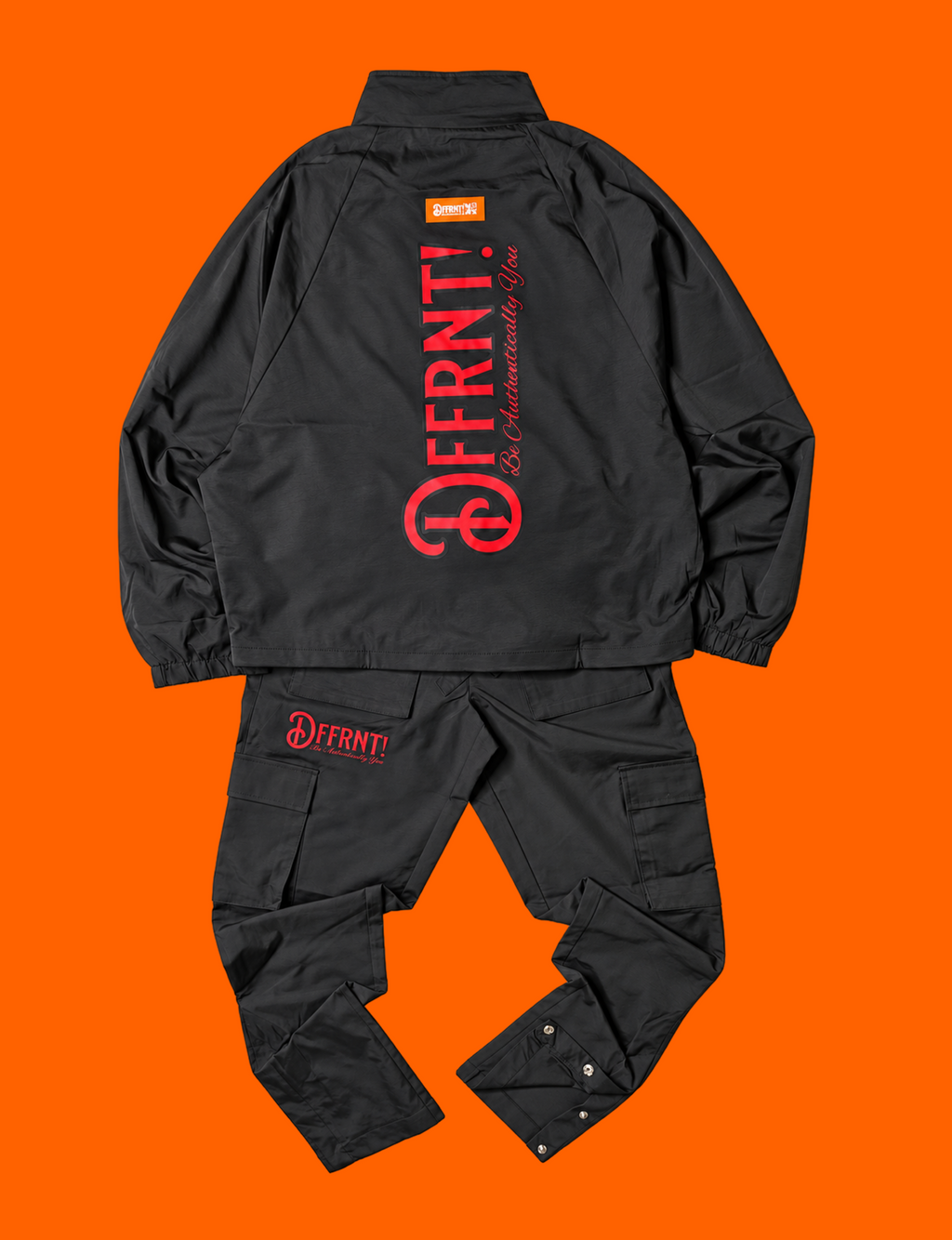 The Standard Tracksuit in black with two-tone black-and-red graphics — back view
