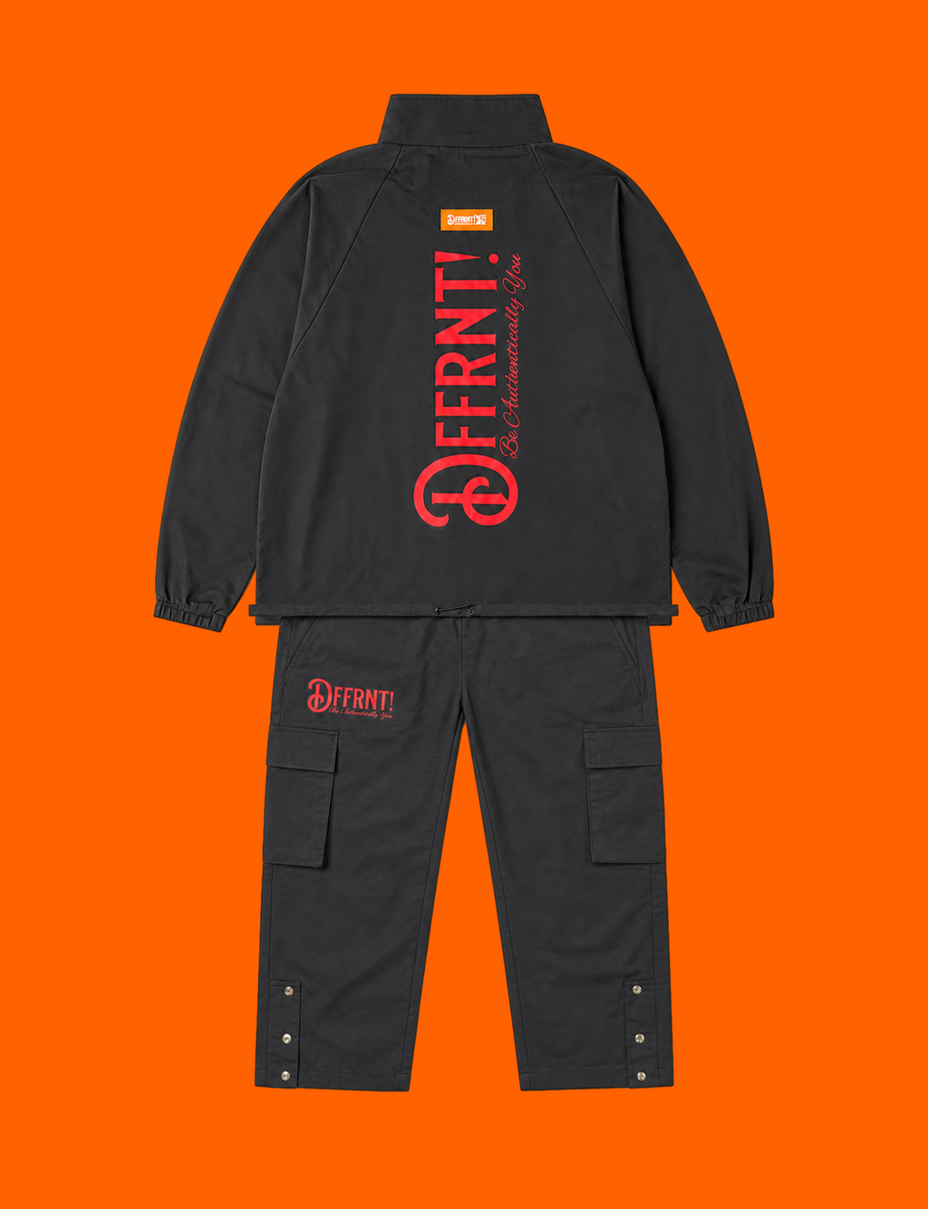The Standard Tracksuit in black with two-tone black-and-red graphics — back view