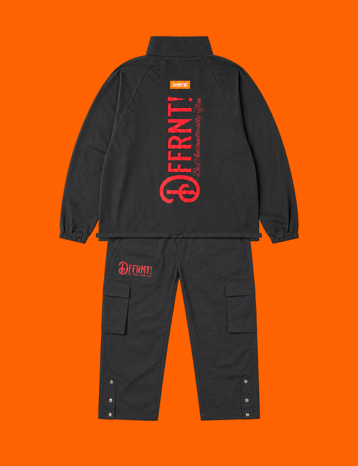 The Standard Tracksuit in black with two-tone black-and-red graphics — back view