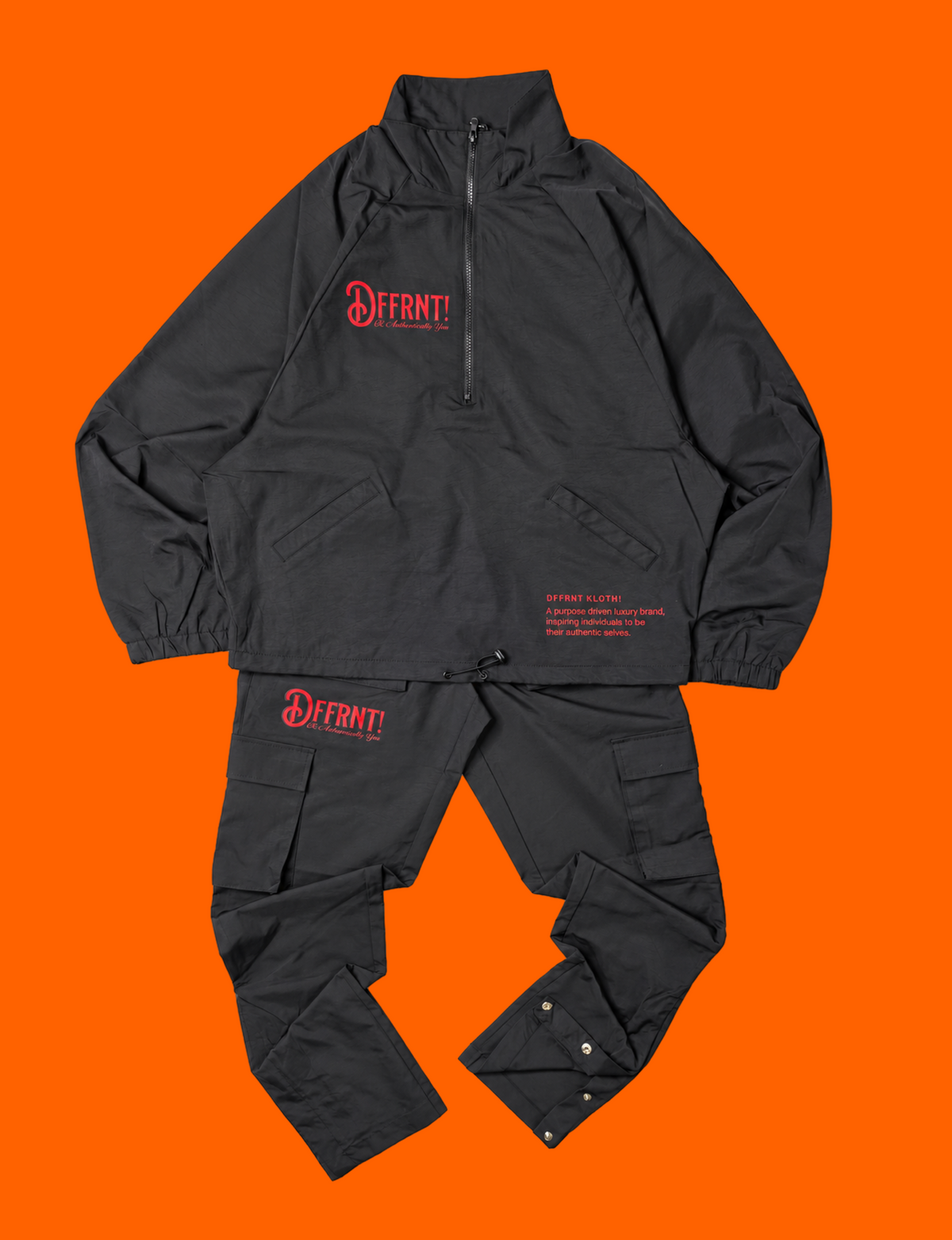 The Standard Tracksuit in black with two-tone black-and-red graphics — front view